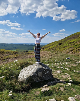 Aimee on rock - edited background.png