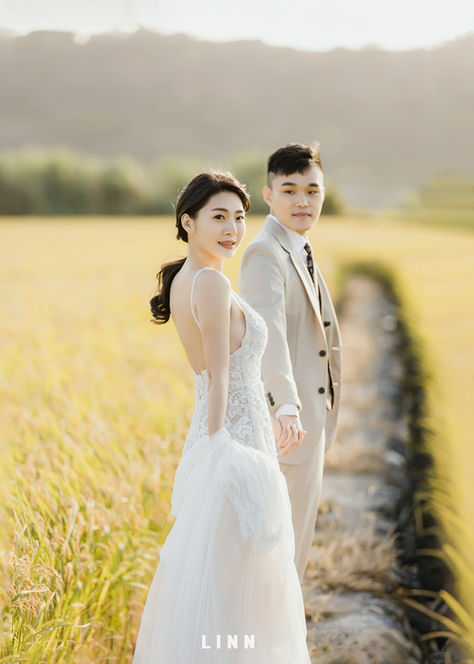 Couple looking back on rice field path