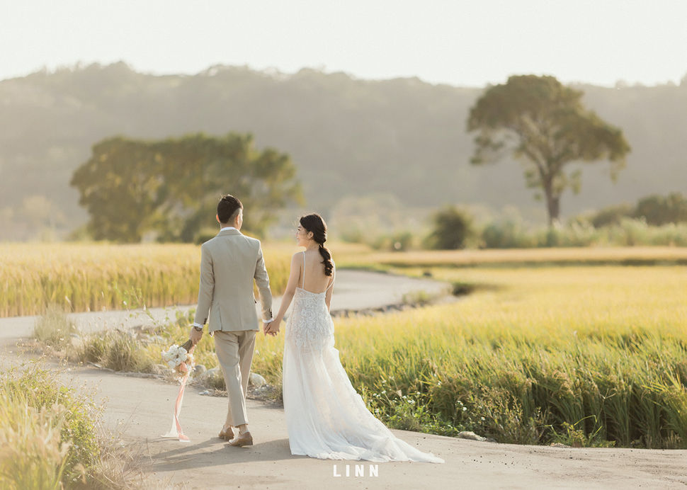  Wedding couple walking away rice field