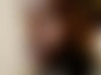 A guy sitting with his eyes closed.