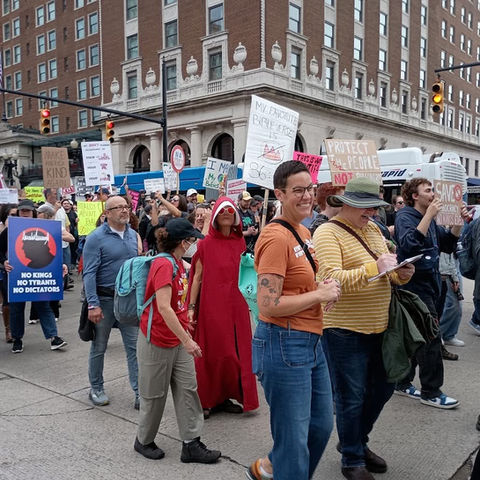 Abbie marching at a No Kings rally