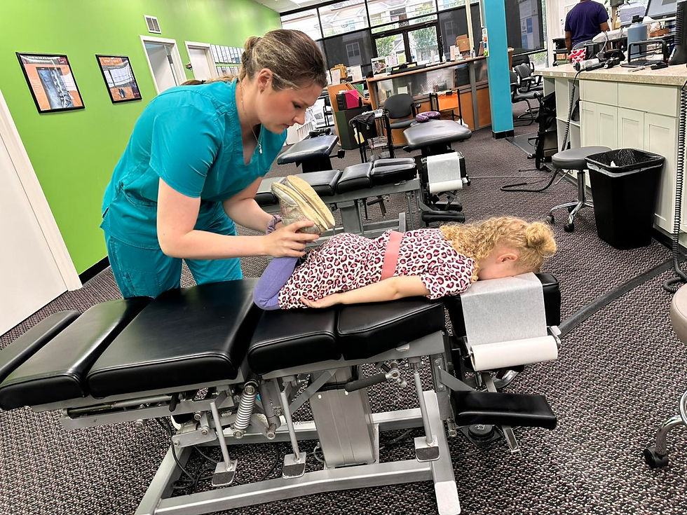 Eye-level view of a chiropractic clinic treatment room with adjustment table