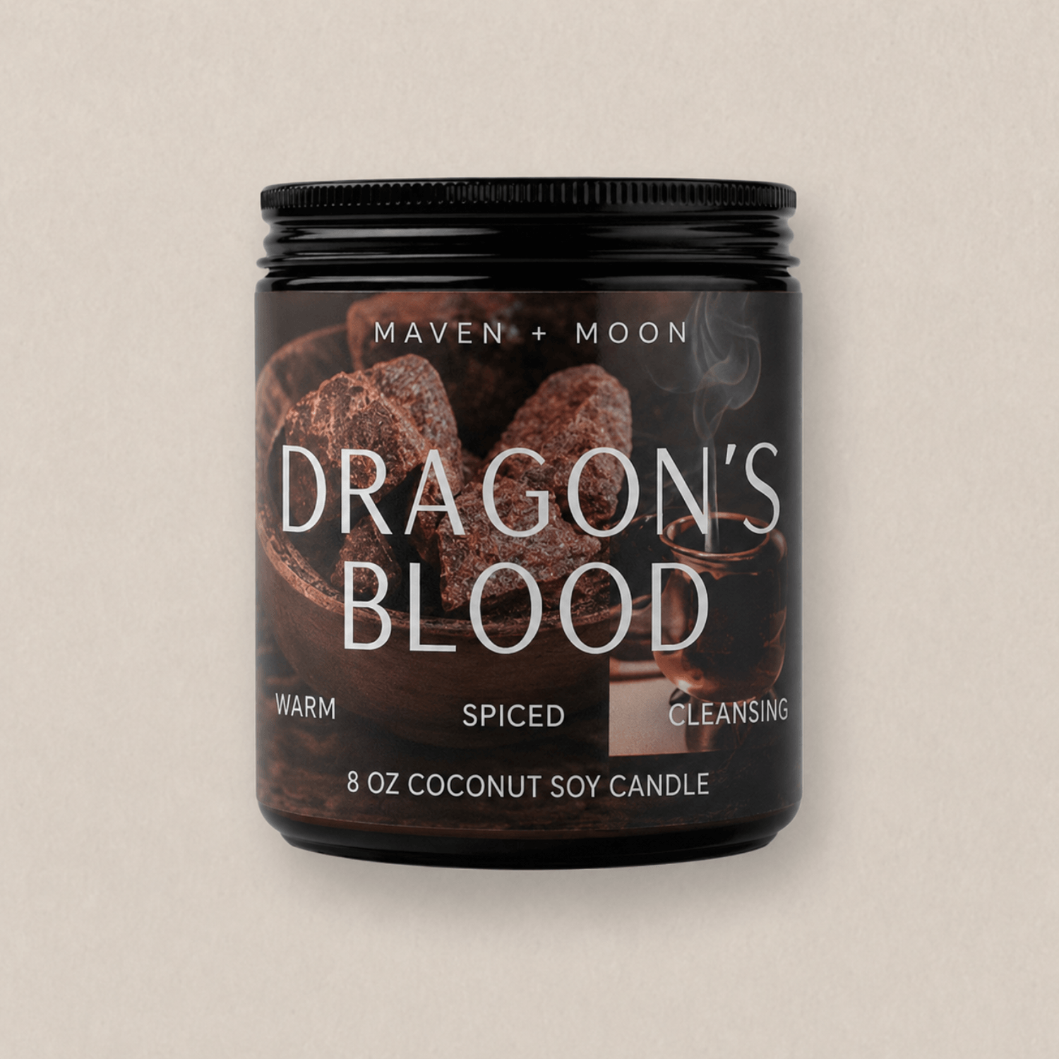 Amber glass dragon's blood candle with minimalist white label photographed against a soft warm neutral background.