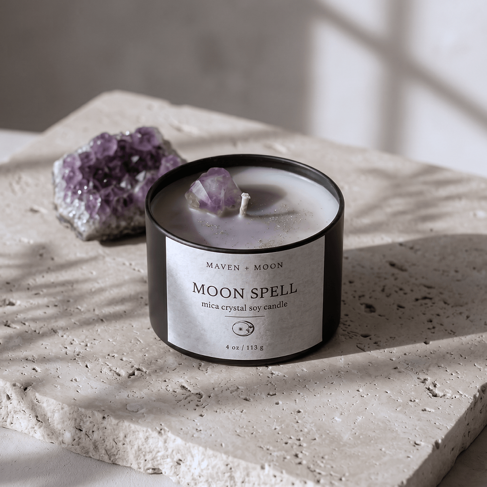 Thumbnail: Top view of Moon Spell crystal soy candle featuring lavender shimmer wax, gold sparkle accents, and a natural amethyst crysta