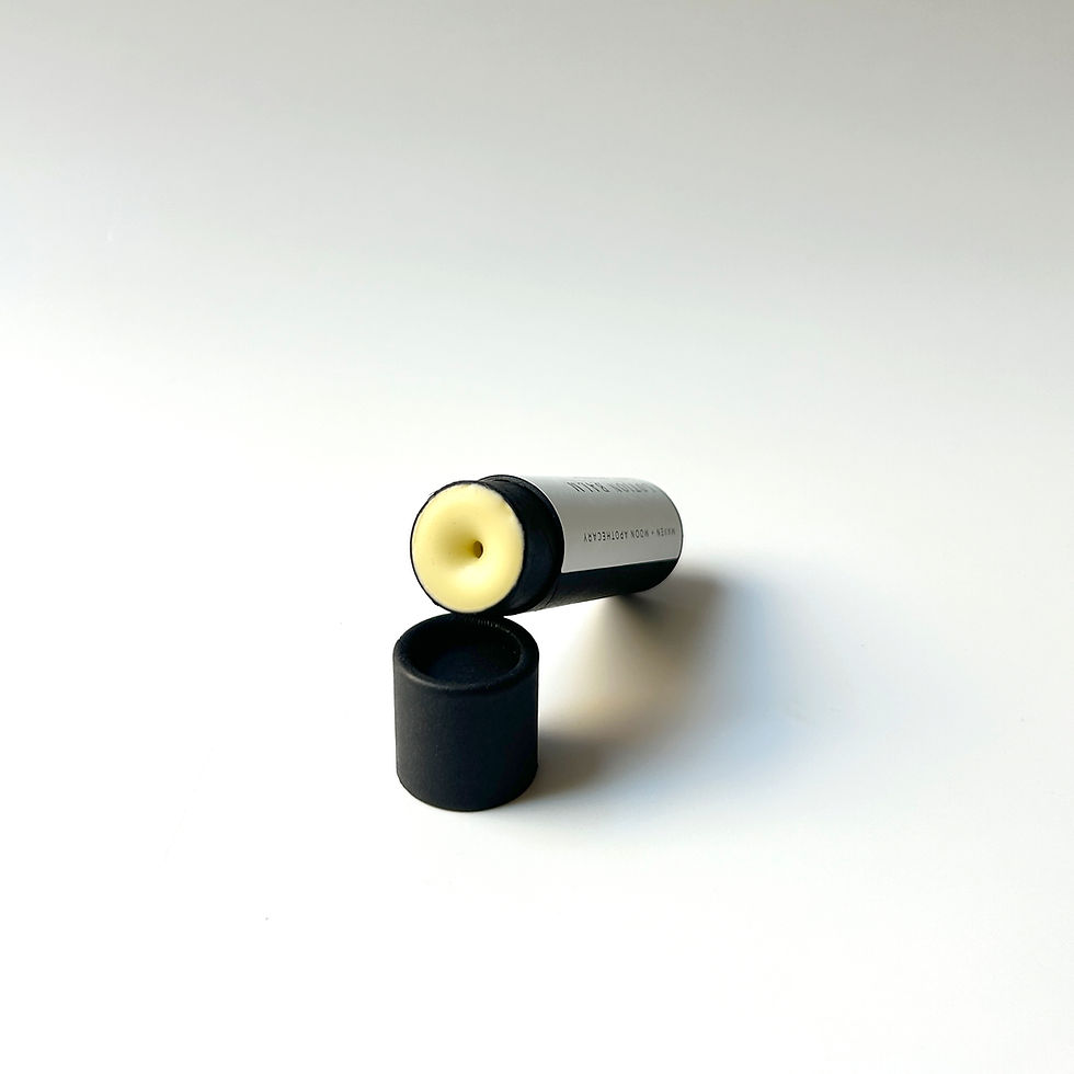 Thumbnail: open image of black roll up tube showing lotion balm