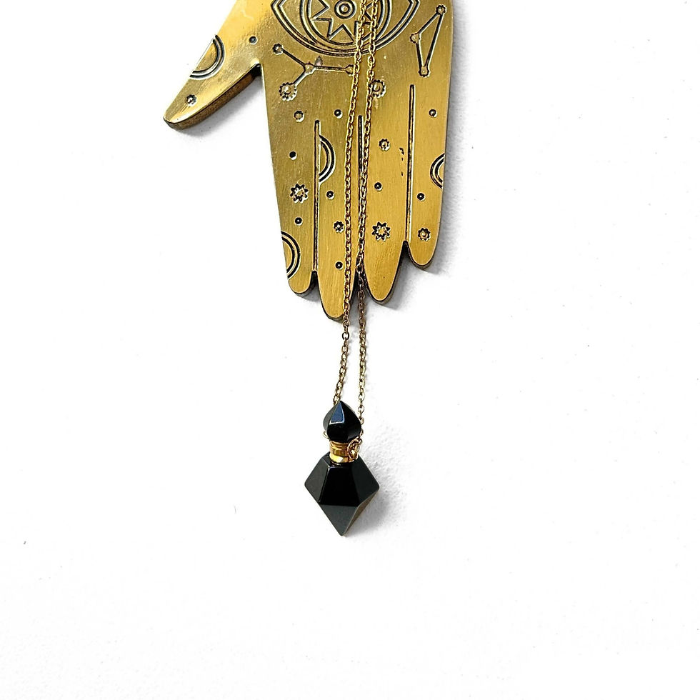 Thumbnail: Carry protection in style. Handcrafted obsidian perfume bottle necklace is carved from volcanic glass.