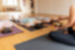 female-yoga-teacher-teaching-class.jpg