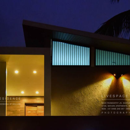 Hermin's Residence, Thrissur — modern home with timber interiors by Livespace Architects — view 1