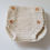 Thumbnail: Cream knitted baby diapers