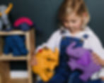 Child playing with adorable animal toys