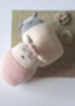 Adorable knitted baby bunnies cuddling