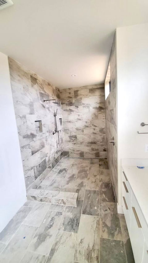 White and gray shower renovation