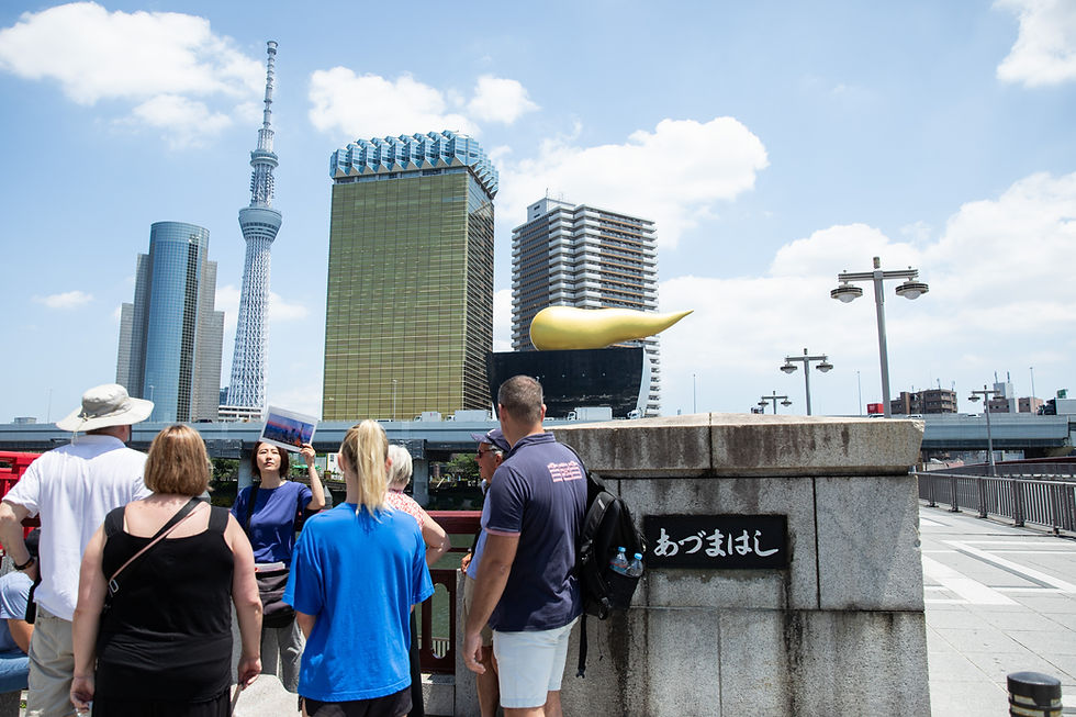 Tokyo Localized tour group at Azumabashi Bridge with Tokyo Skytree in the background