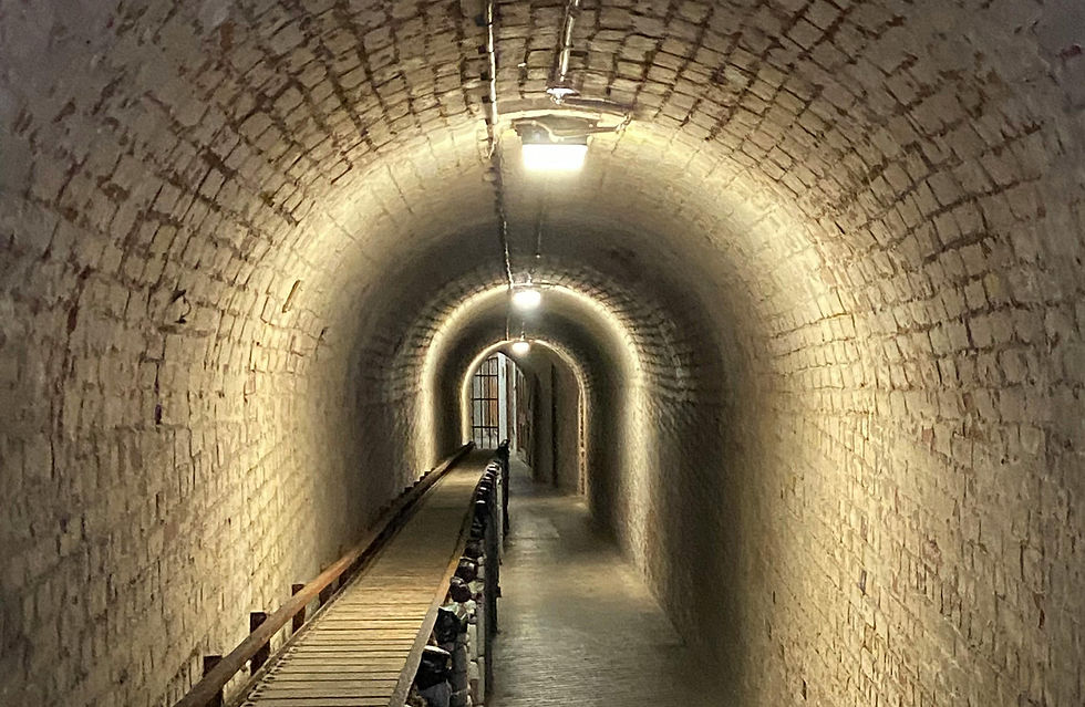 A tunnel with lights and a walkway to showcase the metaphor of tunnel digging and the need for breaks