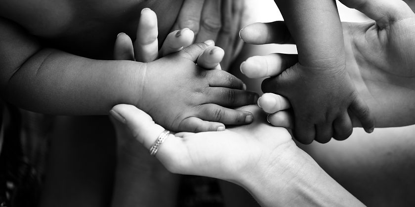 Adoptive family holding hands