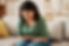 Stress, stomach pain and woman on a sofa with menstruation, gas or constipation, pms or na