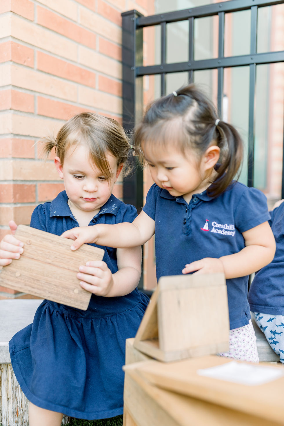 Image of two girls at Cresthill Academy Daycare & Preschool appearing on the 'Our Difference' page