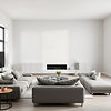 Minimalist modern UK home interior, soft grey and neutral tones, clean open-plan living sp