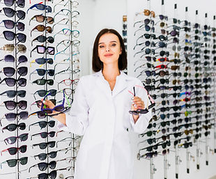 medium-shot-optician-holding-sunglasses-pairs.jpg