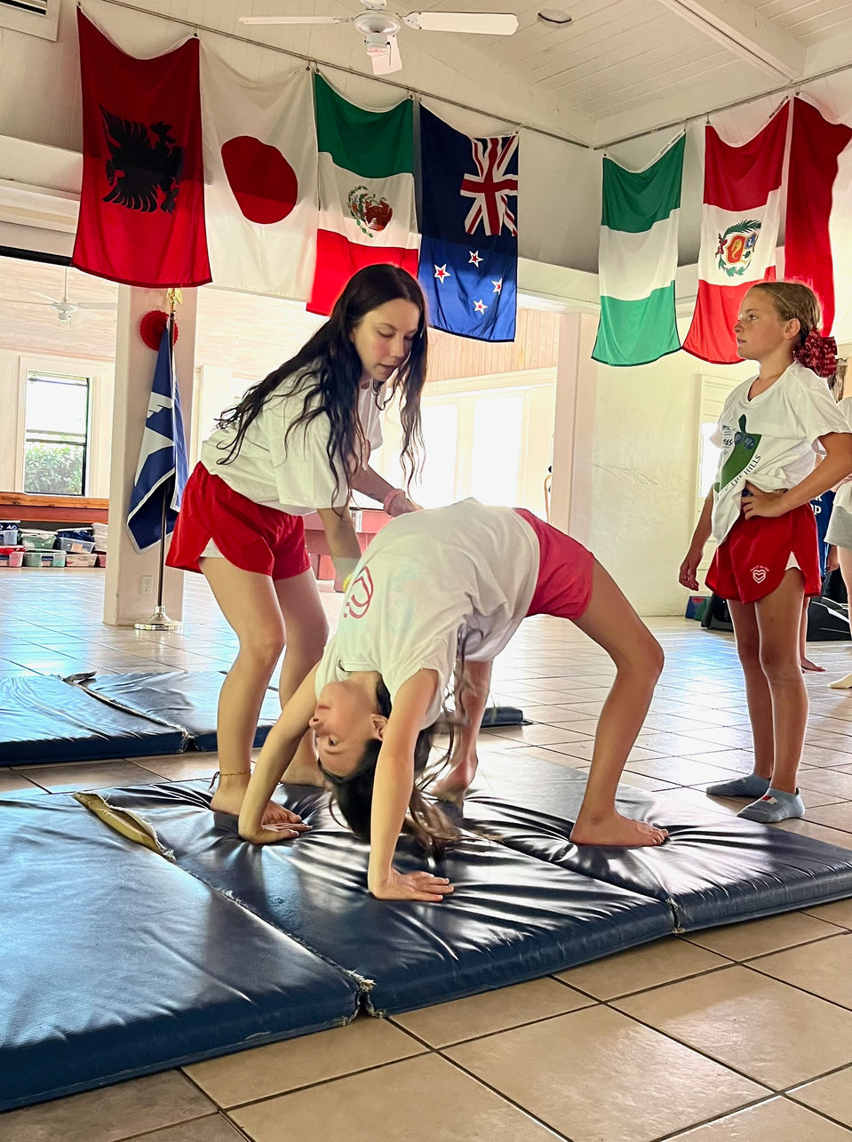 A gymnast with her spotter.