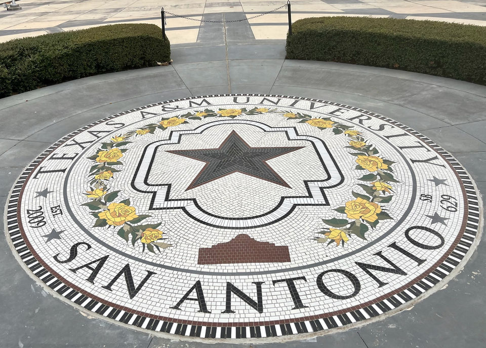 The Texas A&M Presidential Seal done in mosaic tiles as a ground mural on the grounds of the university.