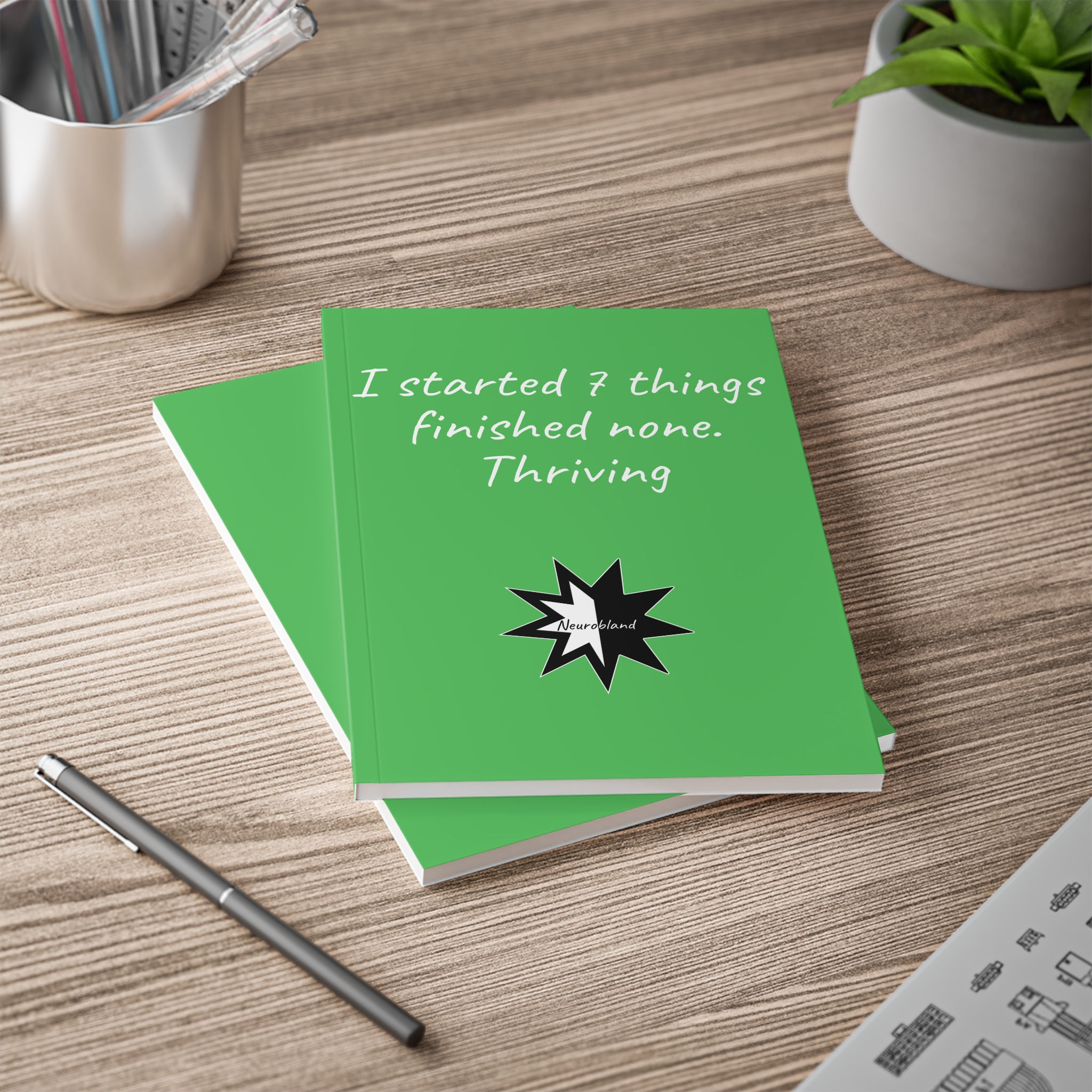 Green A5 lined notebook: I started 7 things finished none.