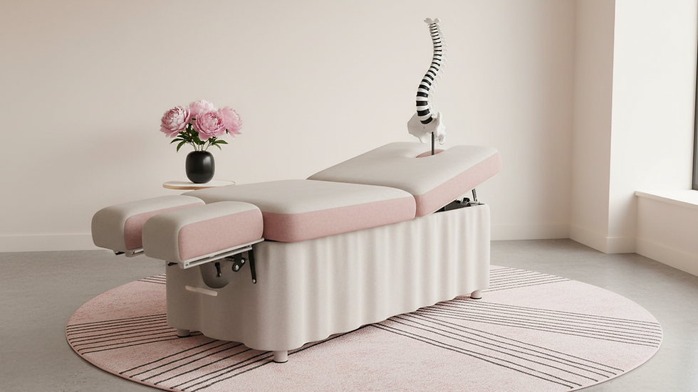 Eye-level view of chiropractic table with spine model