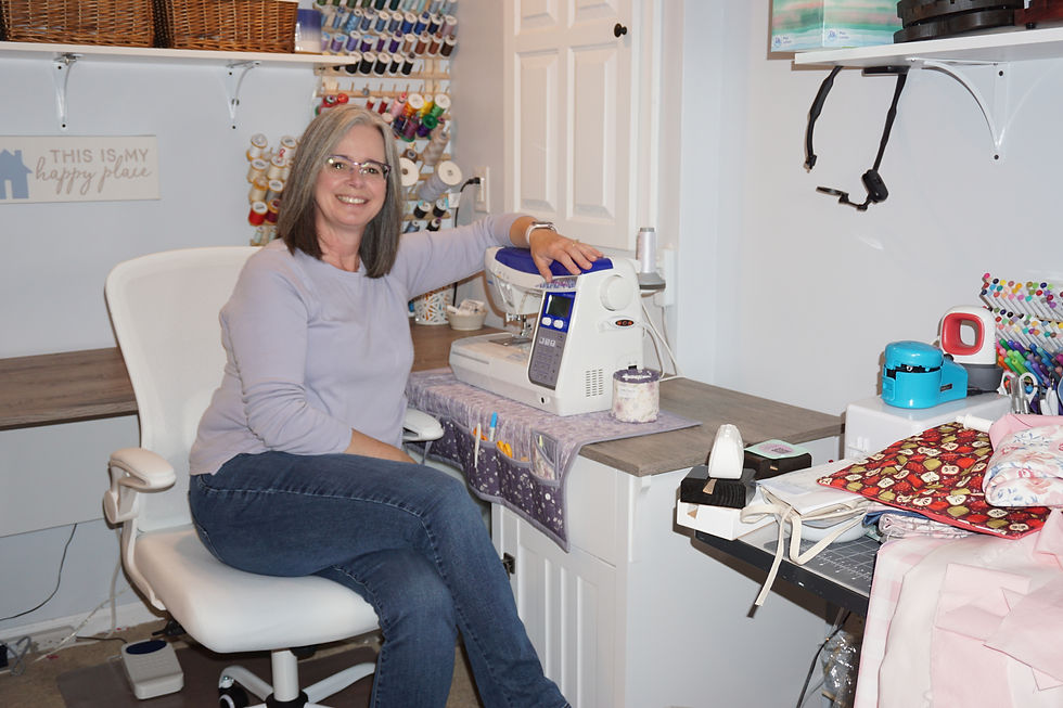 Crafting Therapy Shop owner Rebecca at a sewing machine