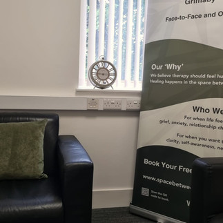 Space Services banner, sofa, and window with text: Confidential Counselling and Life Coaching.
