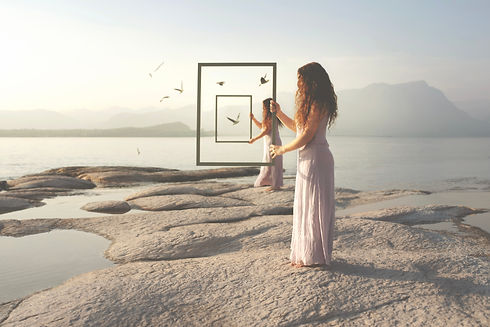 surreal woman in loop with frame framing birds flying free in the sky.jpg