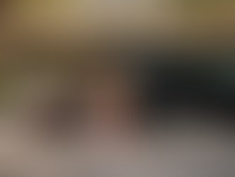 Family loading luggage into SUV outside hotel