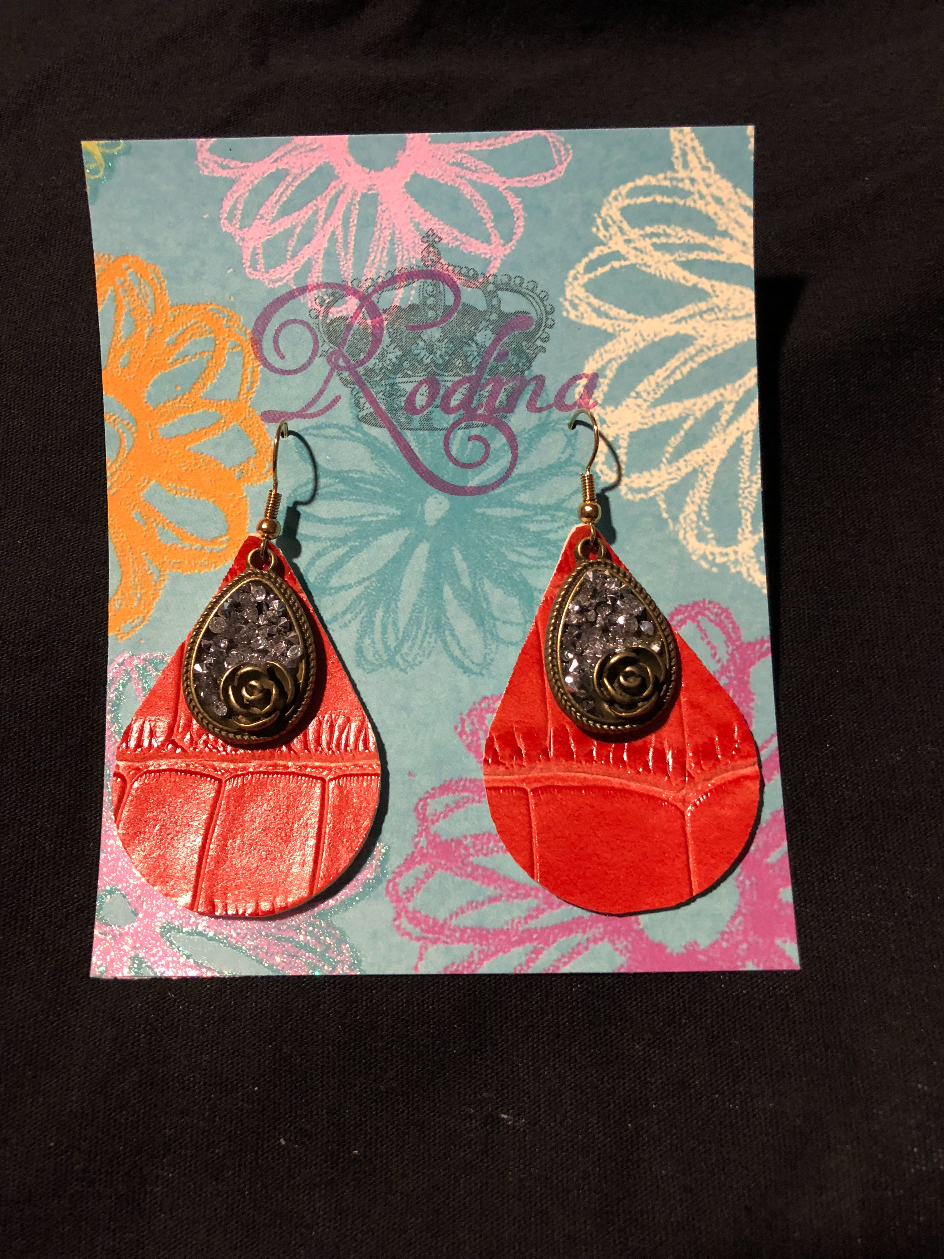 Orange earrings with charm