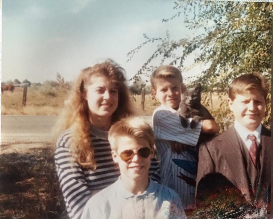 My brothers and I, growing up in south Idaho circa 1980. Dallas is holding our cat (of course) I'm currently fostering his two cats.