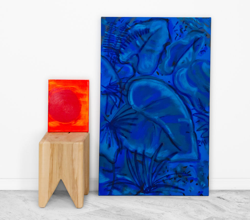 Blue abstract painting with swirling layered forms next to a small bright red panel on a wooden stand