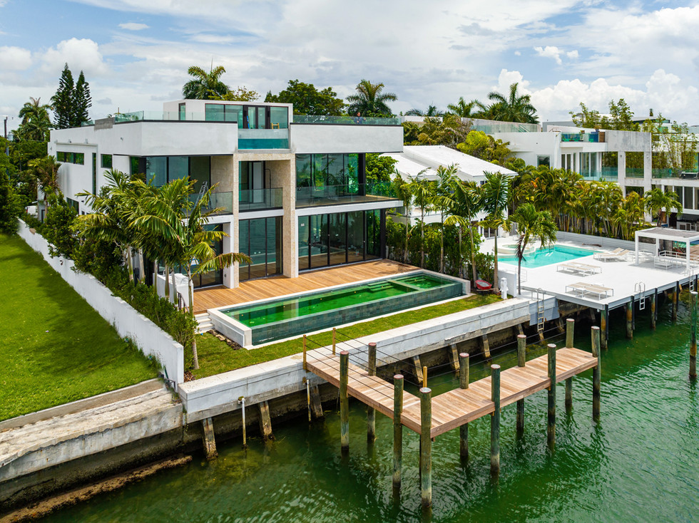 Waterfront modern residence with terraces, pool, landscaping, and private dock in Miami Beach