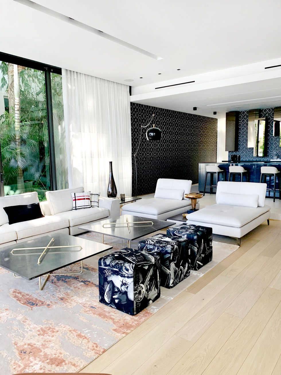 Lounge with bold artwork and marble flooring, Palm Island residence, Miami Beach
