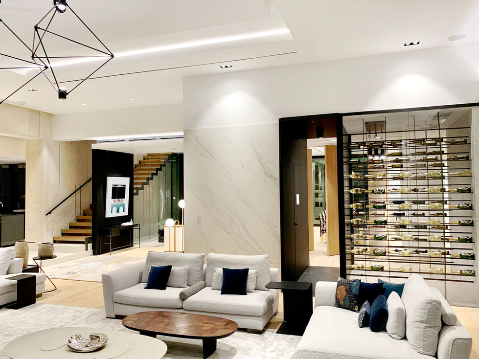 Living room with wine wall and contemporary seating, Palm Island residence, Miami Beach