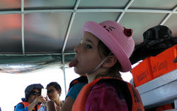 a kid sticking tongue out