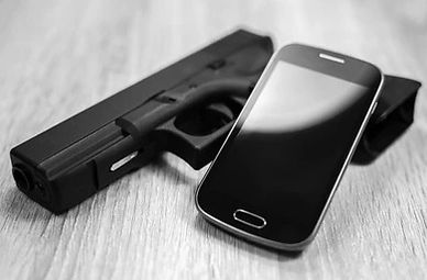 gun-modern-smart-phone-black-260nw-441830167_edited.jpg
