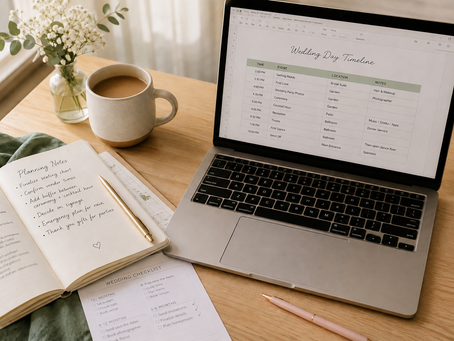 Laptop opened to image of a timeline and a planning notebook with a cup of tea