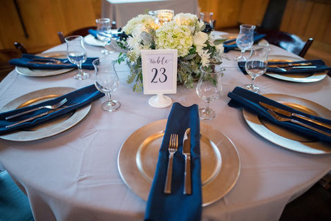 navy and gold tablescape for wedding reception