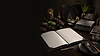 Food product development workspace with ingredients, scales and packaging concept notebook