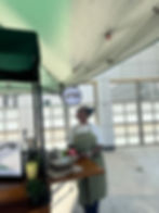 Owner looking up at cart signage