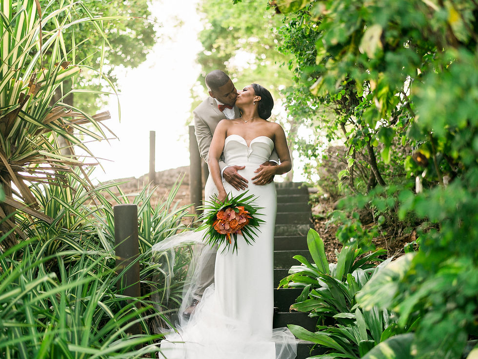 Wedding photographer in Guadeloupe, the bride and groom on the steps at Créole Beach