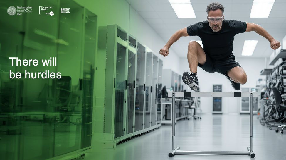 man jumping over hurdle indoors