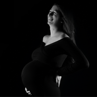 Elegant maternity portrait in black gown at Bedford TX maternity photography studio
