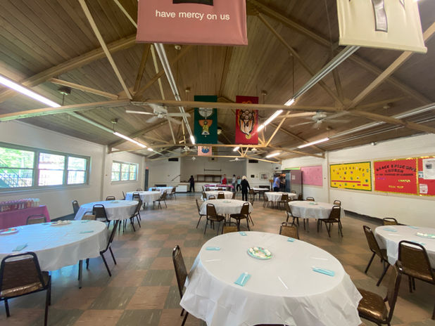 The cafeteria prepared and tables set before guests arrive at the soup kitchen.