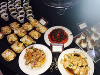 Flat lay of a variety of savory food, including chicken and pork.
