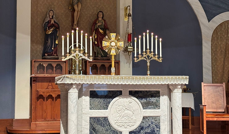 A monstrance with a consecrated host on an altar for adoration in a Catholic Church