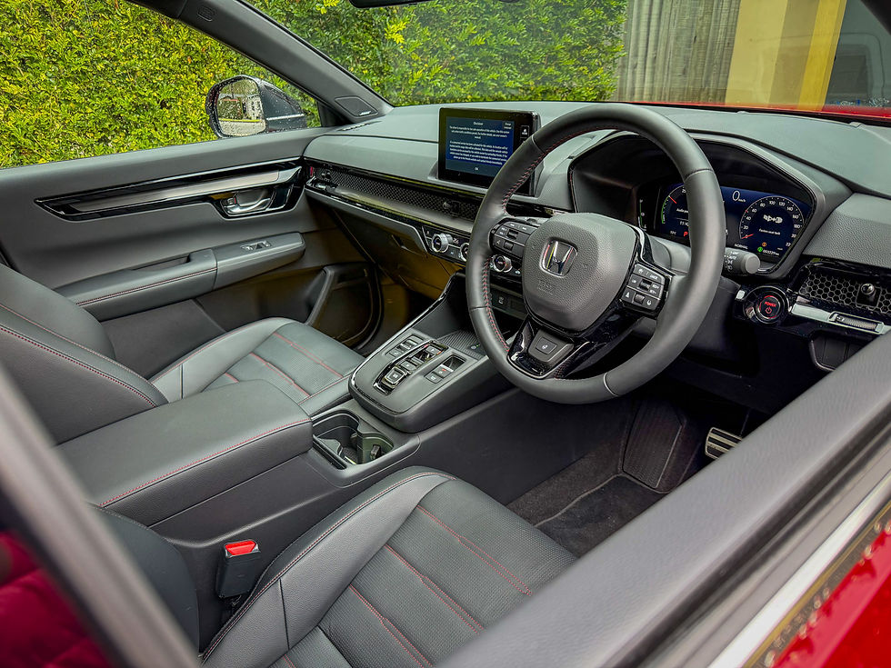 Honda car interior with black leather seats, steering wheel, digital dash, and center screen showing a warning message